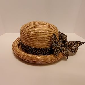 A rolled brim woven straw hat